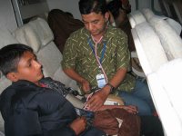 Dr. NB Basnet escorting a child with congenital heart disease in an aeroplane